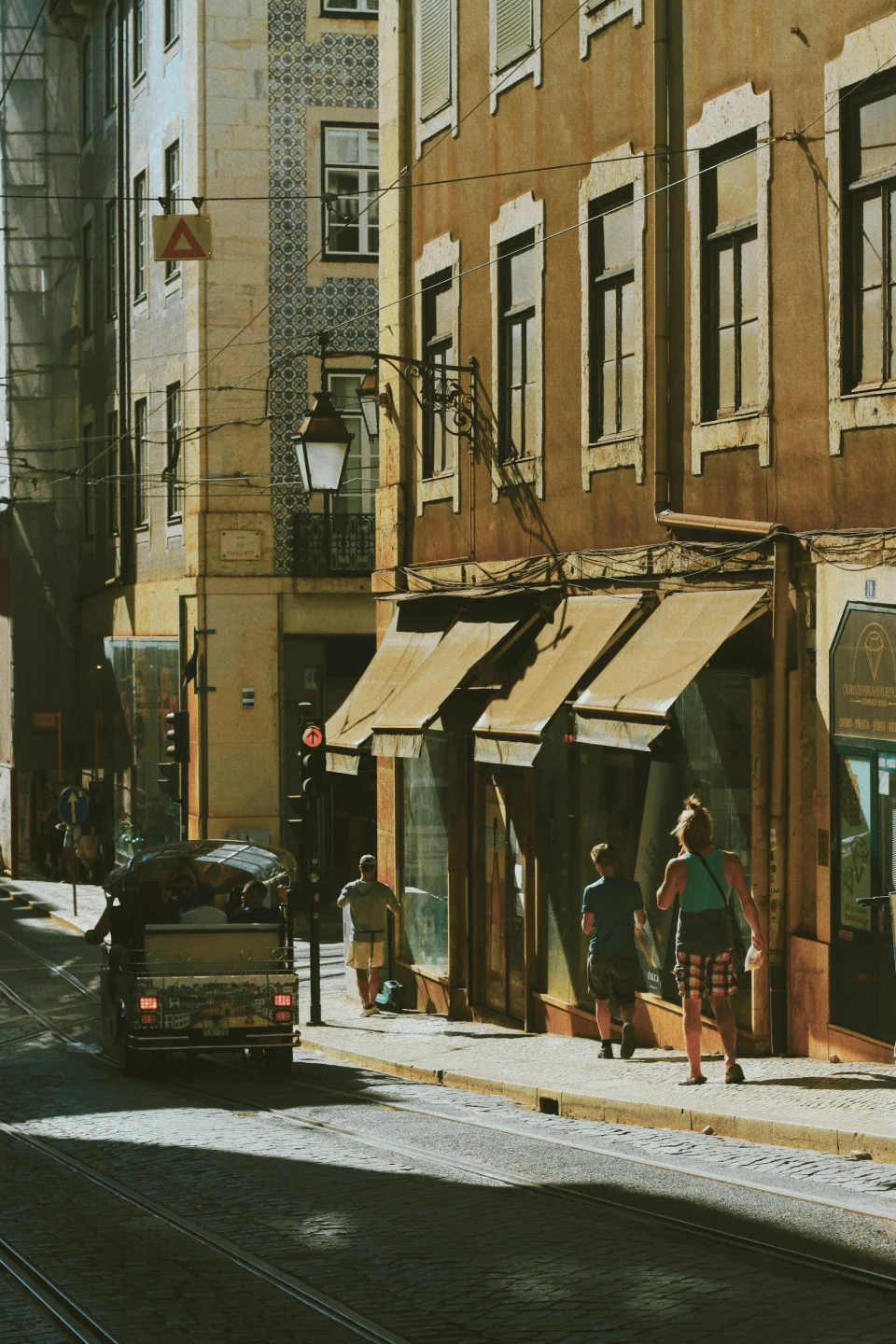 People in a Lisbon street during the evening light